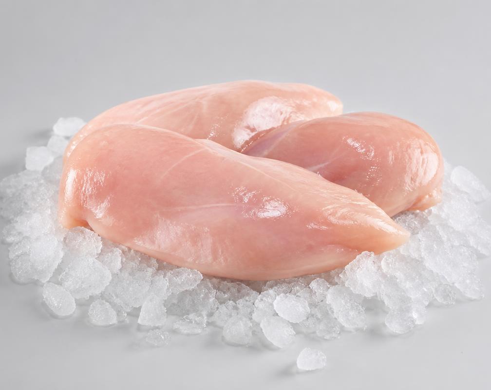 Boneless frozen hen breast fillets on crushed ice, unbranded product photograph